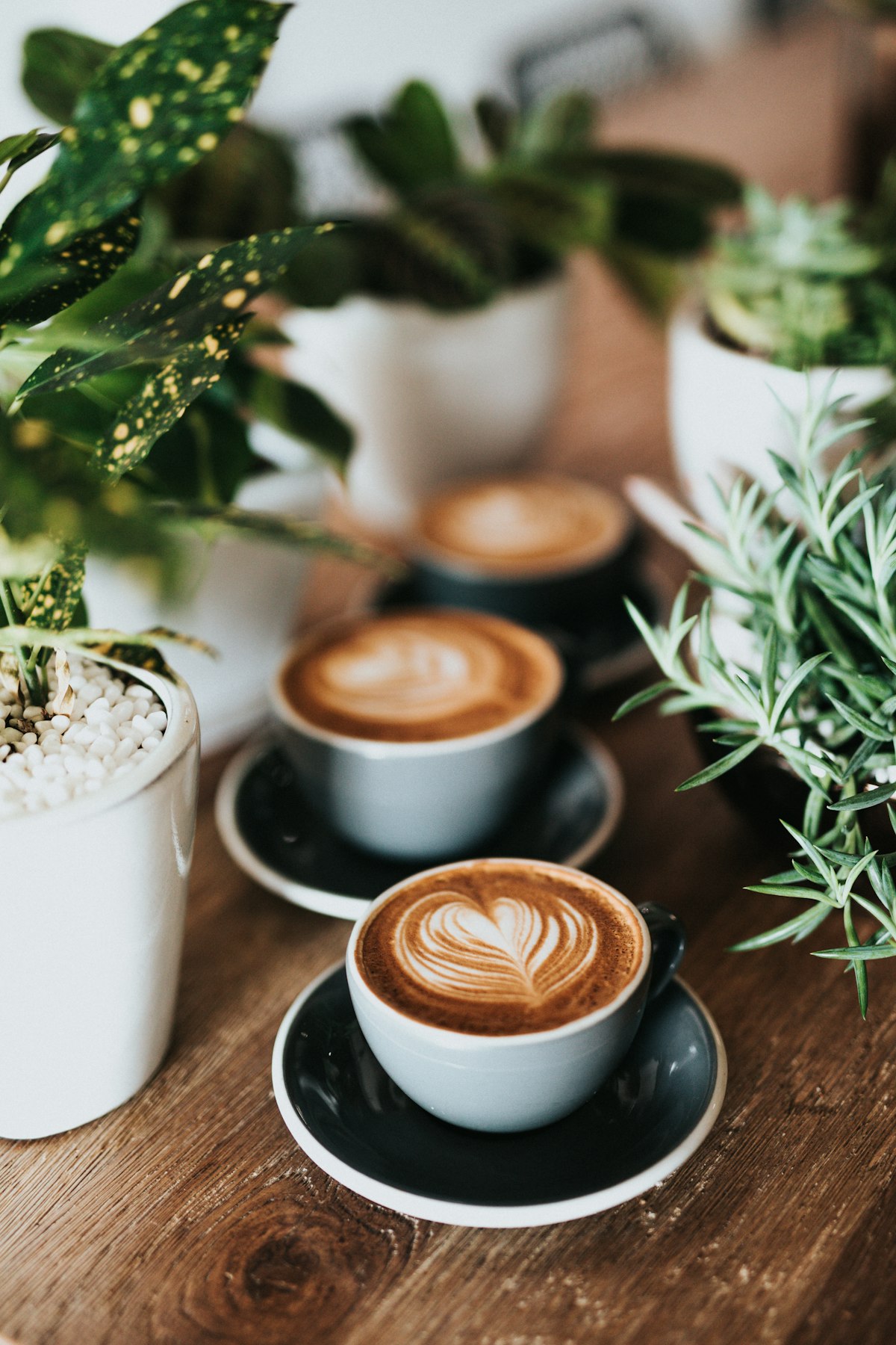 A cup of kopi-o on a worn marble table with a faint ring mark